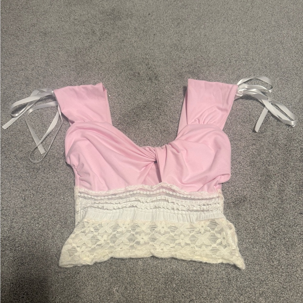 Super cute pink and lace crop top with ribbon bows on the sleeves